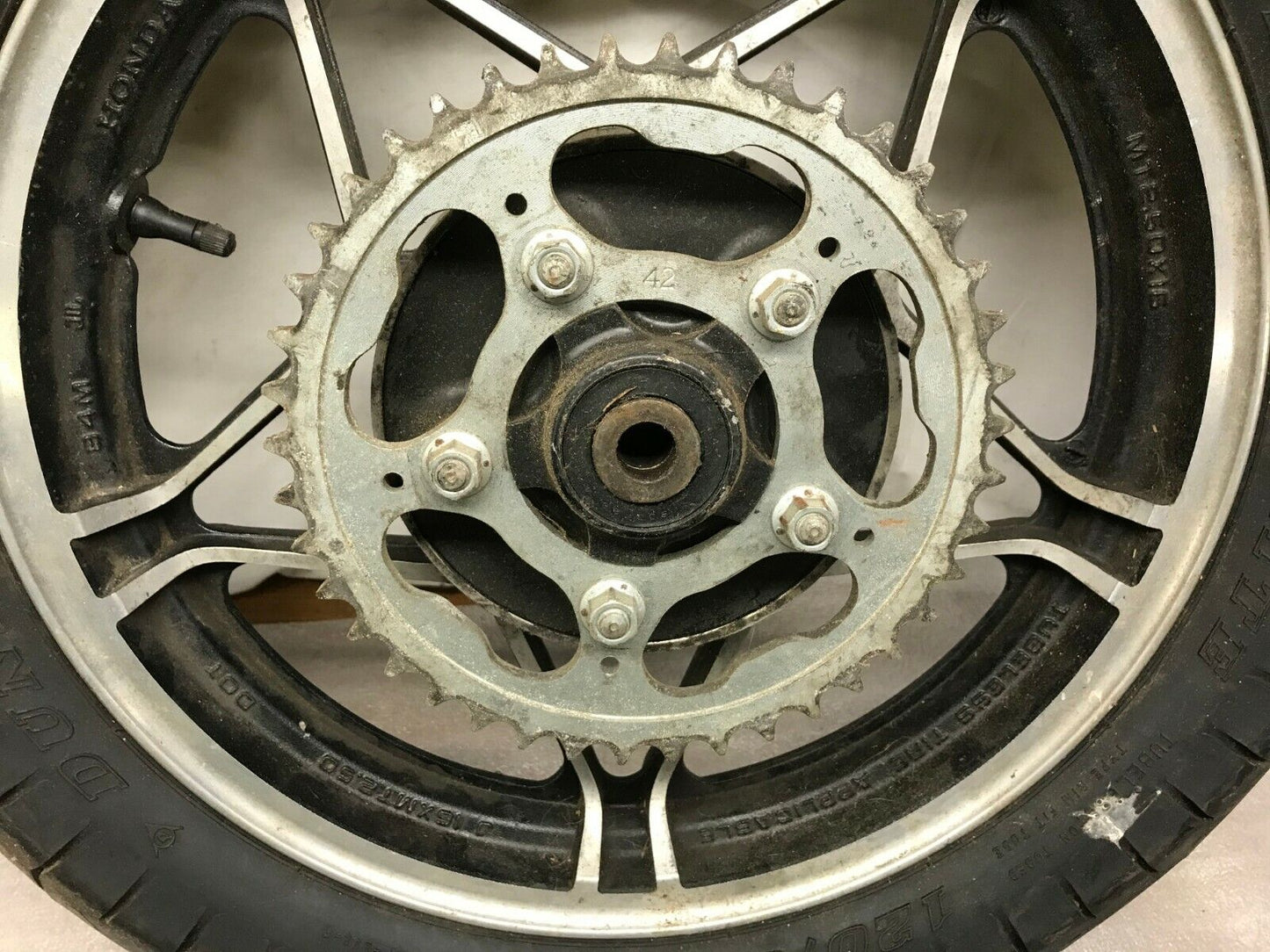 83 HONDA CB550 CB 550 SC NIGHTHAWK OEM REAR WHEEL RIM Tire 3X16 Dunlop k391